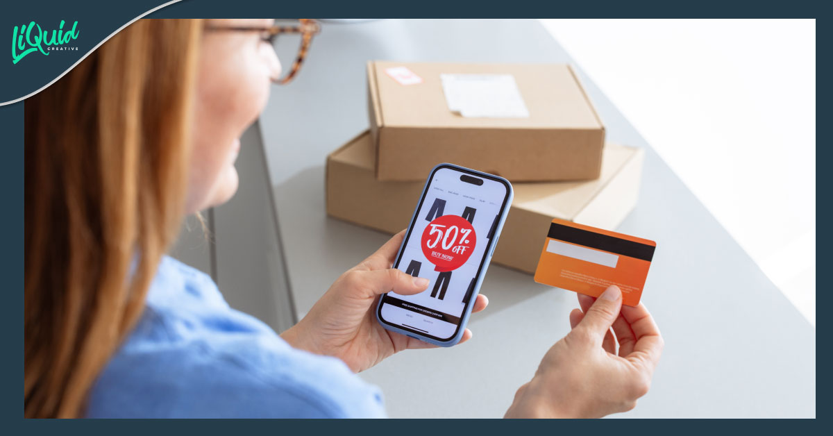 woman holding a phone with shopping deal on the screen holding her credit card