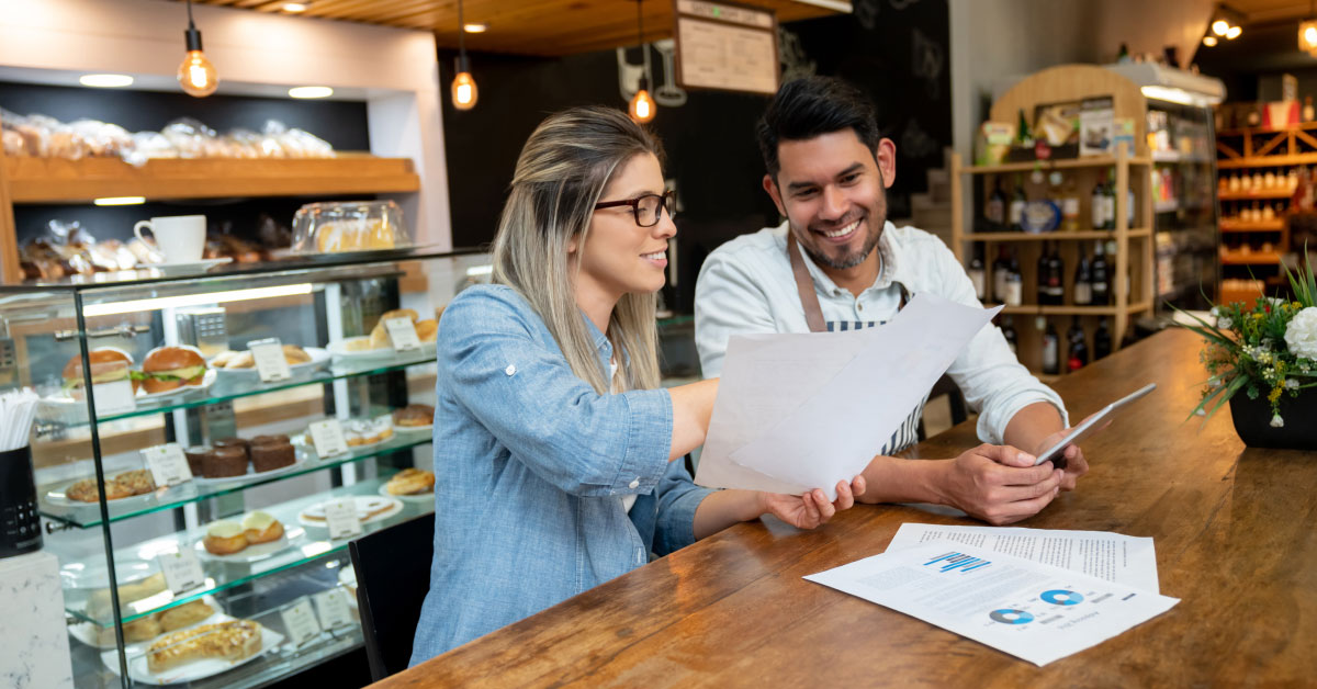 woman and man at the counter of a store