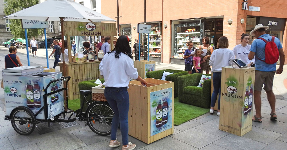 group of people around a vendor station